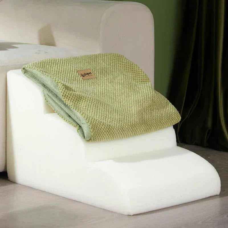 Dog steps with washable cover for easy pet access to beds or couches.